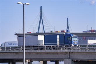 The Köhlbrand Bridge in the port of Hamburg, in front traffic on the A7 motorway, spans the 325 m