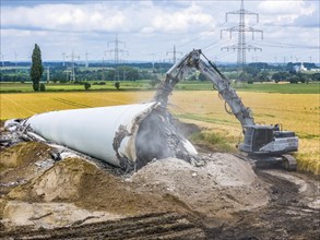 Demolished tower of a 20 year old wind turbine, in the Werl wind farm, 5 old Enercon E-66 turbines