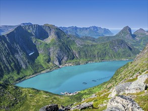 View over fjord Örnfjord to mountain Segla (right), road to Fjordgard, cages of salmon farm in the