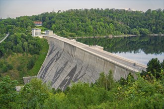 View of a large dam surrounded by green hills and forests, Rappbodetalsperre, Harz Mountains,