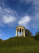 Monopteros with autumn atmosphere and dynamic cloud structure, English Garden, Munich, Bavaria,