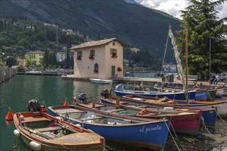 Rowing boats in the harbour, Old Customs House, Torbole, Lake Garda, Trentino, Italy, Europe