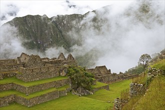 Inca ruins of Machu Picchu in the clouds, Cusco region, Peru, South America