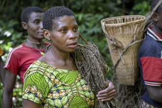 Pygmy woman of the Baka or BaAka people with her hunting net, Dzanga-Sangha Special Dense Forest