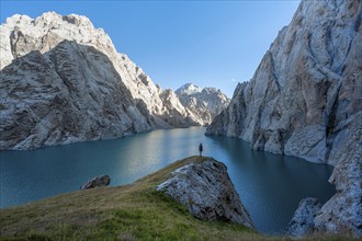 Hiker in front of Kol Suu Mountain Lake, Kol Suu Lake, Sary Beles Mountains, Naryn Province,