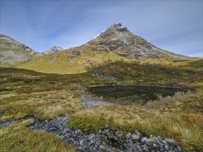 Øvstevatnet with mountain, autumn in Reinheimen National Park, Møre og Romsdal, Norway, Europe