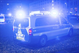 A police vehicle in action, with blue light switched on, Dresden, Saxony, Germany, Europe