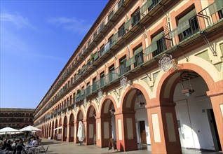 Historic buildings in Plaza de Corredera seventeenth century colonnaded square, Cordoba, Spain,