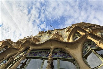 Artfully designed façade, curved windows, Casa Batllo, modernism, view from below, Passeig de