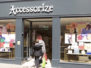 Accessorise shop shoppers entering from street, Tavern Street, Ipswich, Suffolk, England, UK