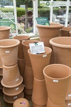 Display of terracotta pots on sale, The Walled garden plant nursery, Benhall, Suffolk, England, UK