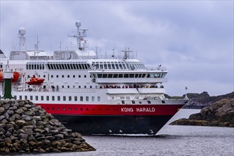 Ship 'Kong Harald' of Hurtigruten company is approaching harbor of Stamsund, island Vestvagøy,