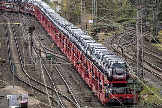 Freight train, car train with Landrover new cars on the goods train line at the Hagen-Vorhalle