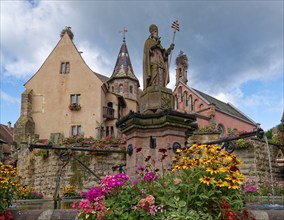 The St. Leon fountain on Saint-Leon Square in the centre of Eguisheim in Alsace. Well-kept