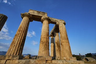 Archaic Temple of Apollo, Doric columns, Ancient row of columns of a temple in the warm sunlight of