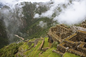 Inca ruins of Machu Picchu in the clouds, Cusco region, Peru, South America