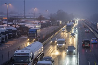 Heavy traffic on the A2 at the Bottrop-Süd service area, overcrowded lorry parking in the evening,