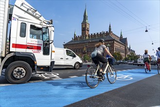 Cyclists on cycle paths, Radhuspladsen, City Hall Square, in the city centre of Copenhagen,