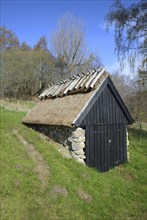 Old thatched fishing hut in Knäbäckshusen, a small fishing village near Rörum, Simrishamn