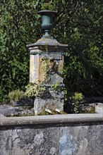 Old historical fountain with curved tap Water spout for permanent drinking water supply Water