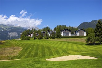 Crans Sur Sierre Golf Course with House and Mountain View in Crans Montana in Valais, Switzerland,