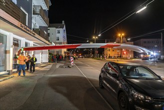 Transport of a 68 metre long, 22 tonne blade of a wind turbine, here in Schwelm, onlookers, with a