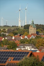 Wind farm above the village of Lichtenau, self-proclaimed energy town, houses with photovoltaic