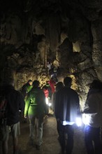 People inside caves, Cueva de la Pileta, near Ronda, Malaga province, southern Spain