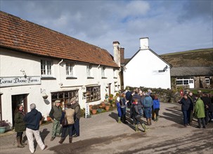 Groups of people outside Lorna Doone Farm, Malmsmead, Exmoor national park, Devon, England, United