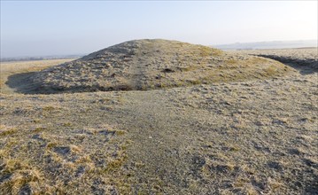 Bronze Age bowl barrow on Windmill Hill, a Neolithic causewayed enclosure, near Avebury, Wiltshire,