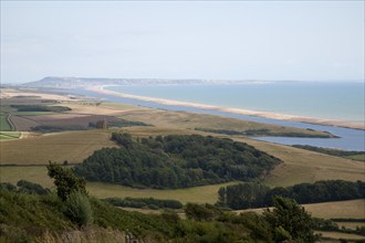 View west along Chesil beach tombolo from Abbotsbury to the Isle Portland, Dorset, England, UK