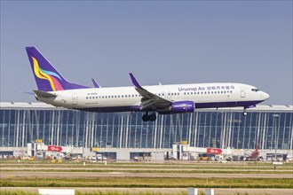 A Boeing 737-800 aircraft of Urumqi Air with the registration number B-6995 at Pudong Airport (PVG)