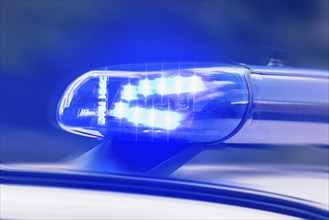 Close-up of a police blue light in action, illuminated and ready for use in an emergency, patrol