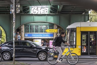 Transport by car, tram and bicycle. Underground station Eberswalder Straße at Prenzlauer Berg in