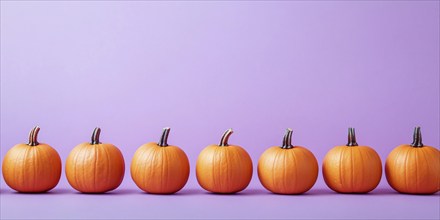 Small orange pumpkins in a row on violet background with copy space. Generative Ai, AI generated