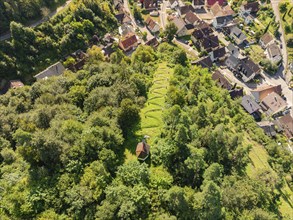 Aerial view of a peaceful cemetery in the forest near a small village, Gundringen, Nagold, Black