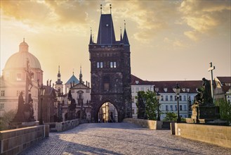 Charles bridge tower in Prague on sunrise, Czech Republic, Europe