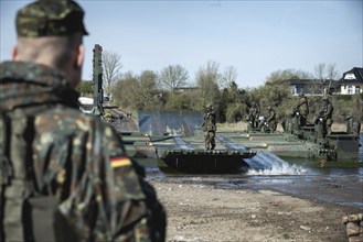 German soldiers of the NATO Response Force (NRF) train a water crossing with amphibious vehicles as