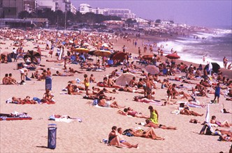 Crowded beach with sunbathers in Calella, Costa Brava, Barselona, ??Catalonia, Spain, Southern