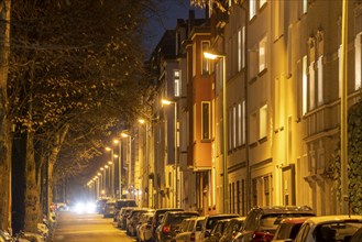 Residential street, many apartment buildings in a residential neighbourhood, evening, lantern