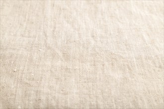 Fragment of smooth white linen tissue. Side view, natural textile background and texture