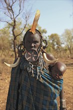 South Ethiopia, in Maco National Park, Mursi tribe, Mursi woman with baby, painted skin and