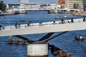 Cyclists on the Lille Langebro cycle and pedestrian bridge over the harbour, Copenhagen is