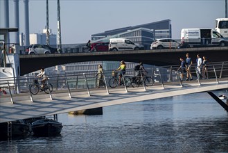 Cyclists on the Lille Langebro cycle and pedestrian bridge over the harbour, Copenhagen is