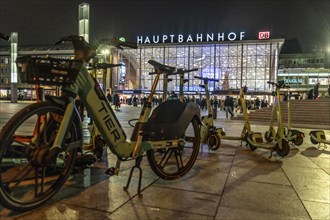 Cologne Central Station, station forecourt, evening, parked e-scooters, North Rhine-Westphalia,