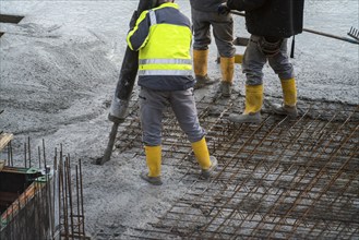 Construction site, concreting, floor, ceiling for a building is concreted, the concrete is pumped