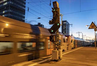 Railway station, RRX regional express train on the platform, skyline of Essen city centre, North