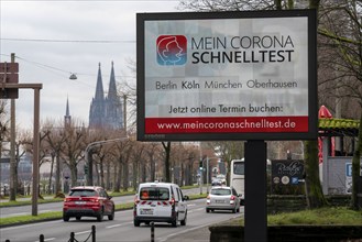 LED billboard, with digital advertising for Corona rapid tests, in the test centre in Cologne, on