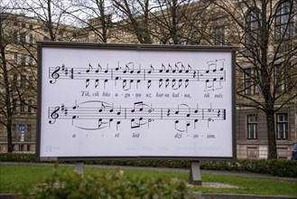 Billboard with sheet music and text line, Riga, Latvia, Europe