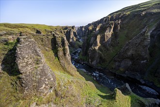 Fjaðrárgljúfur Canyon, Fjadrargljufur, rock formations in rugged deep canyon with river in the